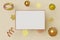 Horizontal mockup picture frame gold color flies on cream background with metallic snowflake in geometric shape. Abstract