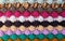 Horizontal multi-coloured stripes of bobble crochet stitches background