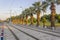 Horizontal perspective shot of tramway in movement with pedestrian stones at sunset time in Izmir at Turkey