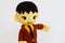 horizontal photo of closeup businessman doll knitting wool extending left arm on white wall background, copyspace