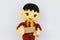 horizontal photo of closeup businessman doll knitting wool holding brown price tag on white wall background, copyspace