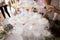 Horizontal photo of a hand that pours champagne into a wedding fountain