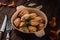 Horizontal photo of russian traditional homemade dumplings stuffed with chanterelle mushrooms in a bowl on a dark wooden