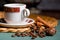 horizontal picture of a beautiful cup of coffee, anise and cinnamon still life on a table