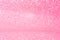 Horizontal pink glitter background with blur