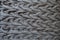 Horizontal plaits on dark grey knit fabric