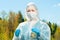 horizontal portrait of a chemist-researcher of a lake`s water composition