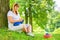 Horizontal portrait of a mature woman on a green lawn