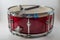 Horizontal Red Wooden snare drum and Jazz brushes isolated on a