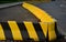 Horizontal road marking lanes. highway concrete barriers on the road. vehicle collision lane separator. yellow color with black st