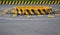 Horizontal road marking lanes. highway concrete barriers on the road. vehicle collision lane separator. yellow color with black st