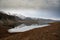 Horizontal scenic shot of a mountain range reflected on the waters of Azat reservoir in Armenia