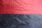 Horizontal seam between red and dark blue suede