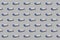 Horizontal seamless pattern. Rolls of blue garbage bags isolated on gray background. On the roll white copy space.