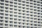 Horizontal shot of balconies of modern apartment buildings in the city during daylight