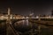 Horizontal shot of beautiful Italian statues reflected in the lake at night under the dark sky