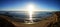 Horizontal shot of a beautiful sea with the reflection of bright sun rays