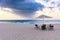 Horizontal shot of the beautiful view of the beach and sea, with umbrella and chairs in Aruba