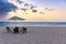 Horizontal shot of the beautiful view of the beach and sea, with umbrella and chairs in Aruba