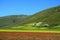 Horizontal shot of the breathtaking and colorful landscape of Castelluccio village