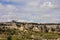 Horizontal shot of fairy chimneys of Cappadocia in Turkey in spring with green grass and small trees shot on cloudy days