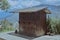 Horizontal shot of an old metal shed in a secluded area on a gloomy day