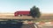 Horizontal shot of a red truck and an isolated green-leafed tree under the clear blue sky