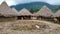 Horizontal shot of Tairona huts on the trail to the \\\