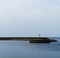 Horizontal simple Danish quay with lighthouse