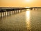 Horizontal skyline Wooded bridge pole in the port between sunrise against orange sky calm peaceful moment relax holiday concept