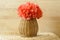 Horizontal Vase basket with red tissue paper flowe
