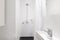 Horizontal verion of white ensuite bathroom in renovated home