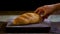 Horizontal video of a rye bread, wheat bran, a hand is shown taking a loaf of bread