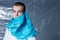 Horizontal view. Frontal portrait of a guy have covered mouth with blue plastic bag. Ecologic content