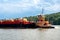 Horizontal view of the HAGGERTY GIRLS, a Pusher Tug, built in 2013 pushing a barge down the