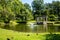 Horizontal view of historic Congress Park, a park with landscaped grounds, statuary,