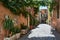 An horizontal view of picturesque old apartments and aged walls in an alley in Trastevere, Rome, Italy