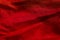 Horizontal view of red fabric texture background. Red color textile backdrop.