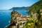 Horizontal View of the Town of Vernazza on blue Sea and the Coastline of the Liguria Background.