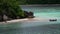 Horizontal view of tropical island with boat, Therese Island, Mahe, Seychelles.