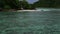 Horizontal view of tropical island with boat, Therese Island, Mahe, Seychelles.