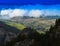 Horizontal vivid cloudscape in mountain forest background