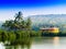 Horizontal vivid Indian house palms with river reflection backgr