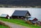 Horizontal vivid Norway house on the bank of the river landscape