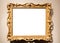 Horizontal wide baroque painting frame on wall