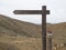 Horizontal wooden signpost. Trail Marking On Wooden Stake In Volcanic Landscape. View of wooden directional sign on a pole