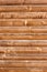 Horizontally tiled stained wood wall texture background