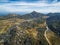 The Horn Peak and winding road, Mount Buffalo National Park - be