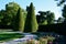 Hornbeams, yews and boxwoods shaped into giant cone shapes with rounded cone-shaped tips. Tall hedges of bosquets evergreen rich c