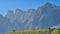 Hornischegg - Herd of wild horses grazing on alpine meadow with scenic view of Sextner Rotwand, Sexten Dolomites